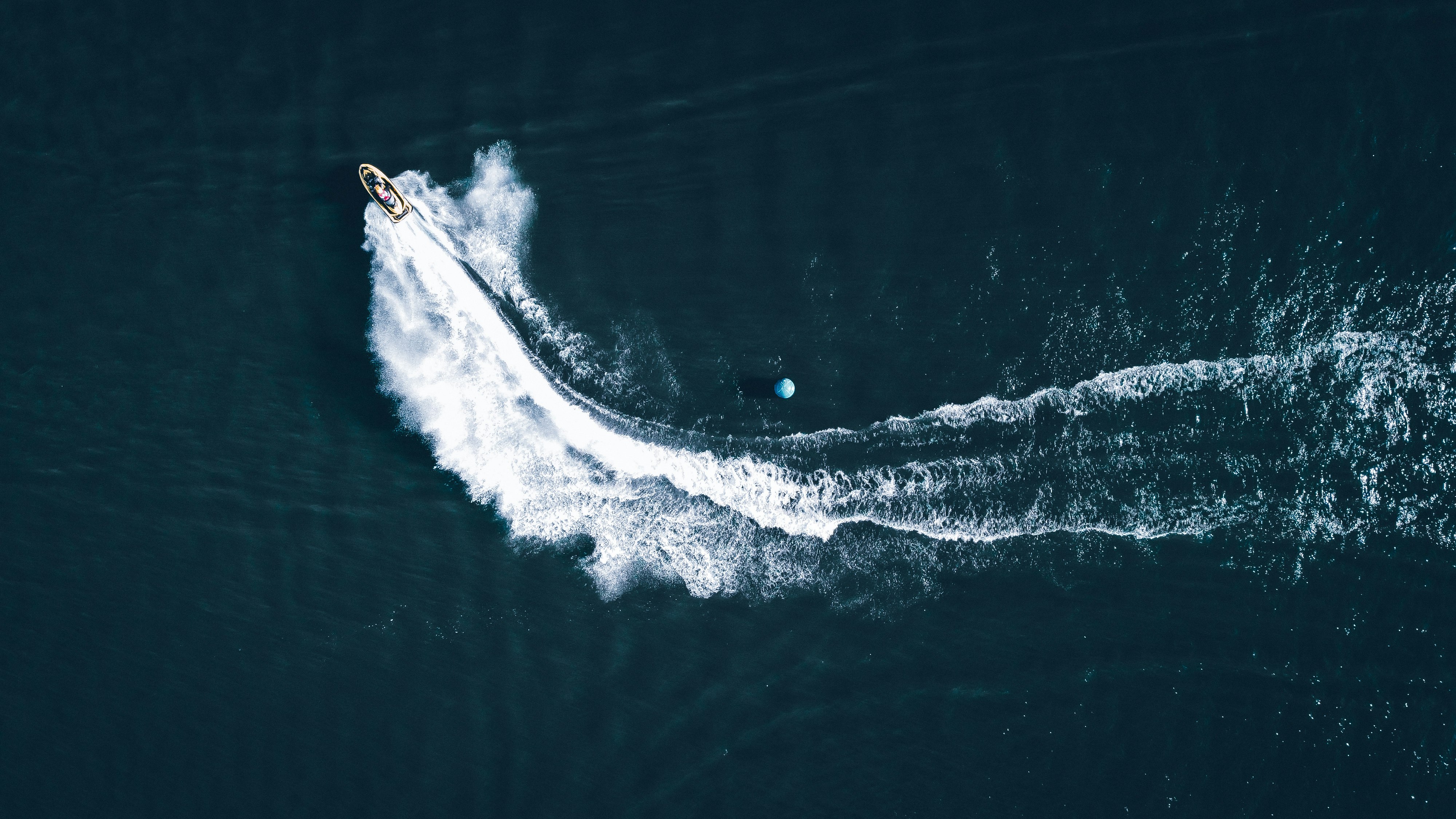 white and black boat on sea during daytime